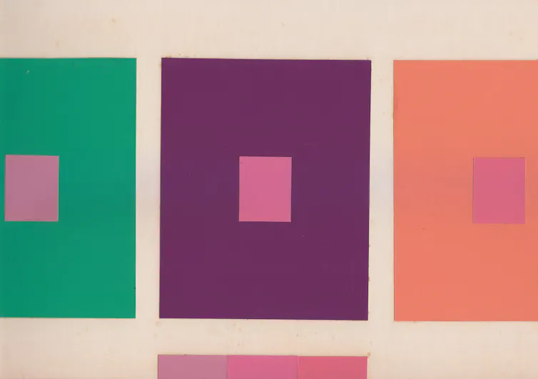 Green, purple and orange squares with smaller squares in shades of pink placed at their centers and at the bottom of the image