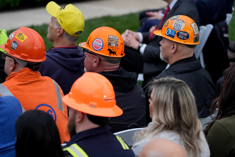 Attendees listen during a tariff announcement in the Rose Garden of the White House