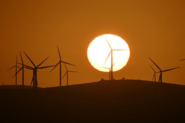 wind turbines at sunset