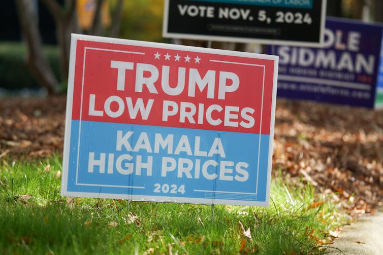 A sign reading 'Trump low prices Kamala high prices'.