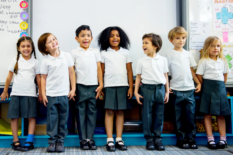 Group of smiling children in school uniform