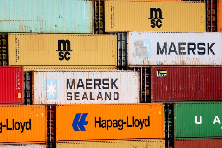 International Affairs Briefing: International considers reaction to Trump’s price lists – and Israel launches new Gaza offensive 1 Shipping containers stacked on top of each other.