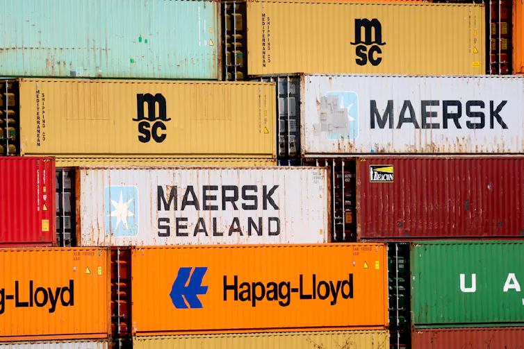 Shipping containers stacked on top of each other.
