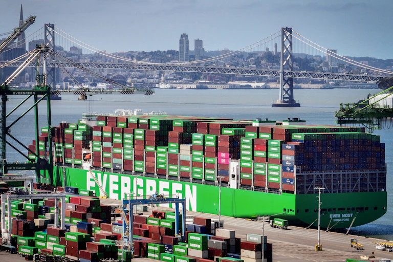A ship with cargo is docked at The Port of Oakland in Oakland California