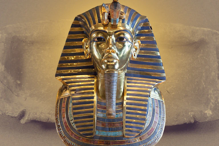 Tutankhamun's gold burial mask and one of the plain clay trays.
