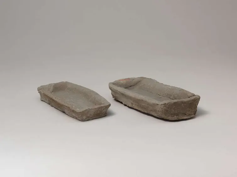 two very plain clay trays