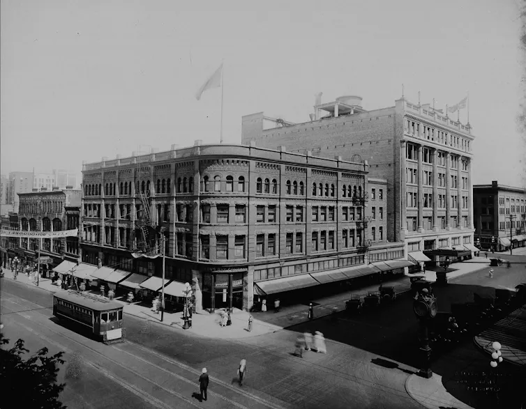 Black and white photo of two large buildings
