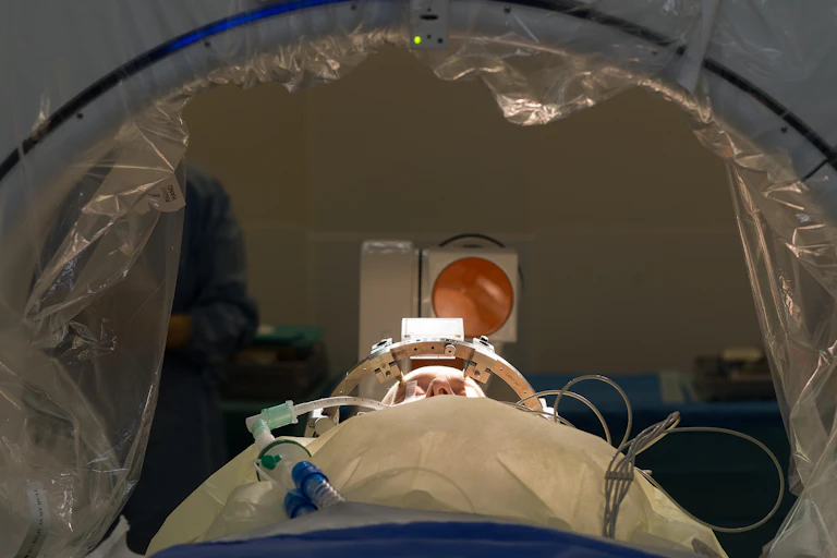 Patient having deep brain stimulation device implanted.