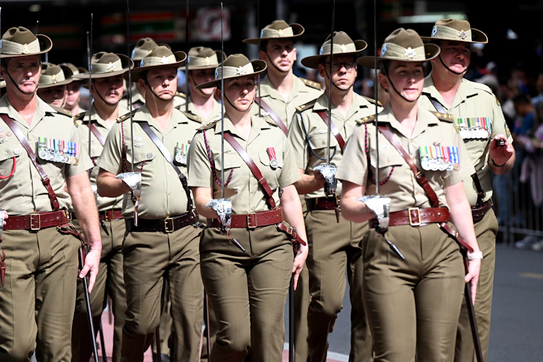 Members of the Australian Defence Force (ADF) are seen marching during the ANZAC Day March in Brisbane