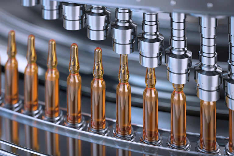 Vaccine vials on a processing line.