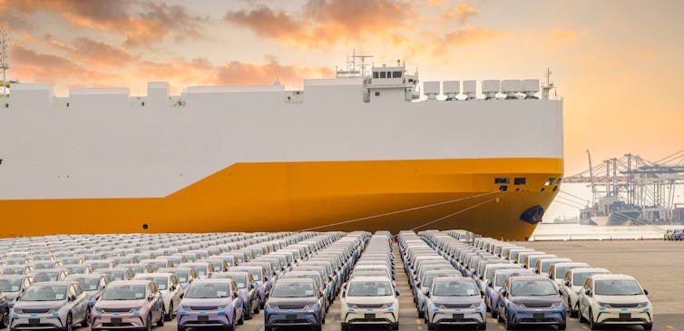 cars and a car transporter ship.