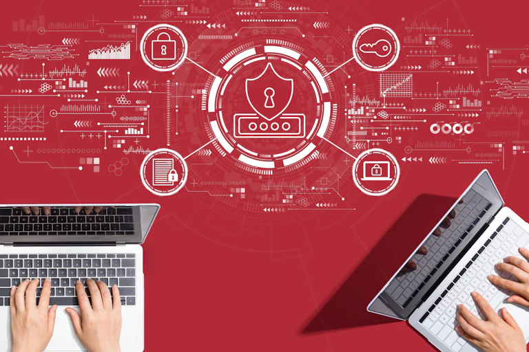 two laptops against a red background with an illustration of computer icons