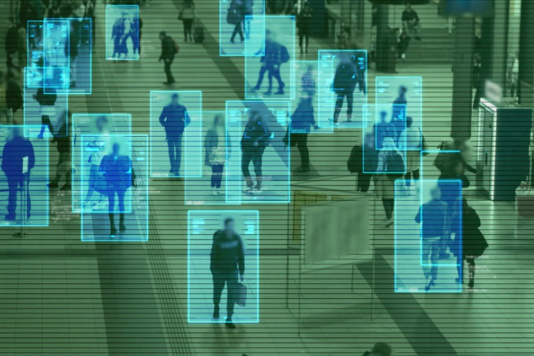 A composite illustrattion representing artificial intelligence using computer-generated images of individuals walking in a railway station.