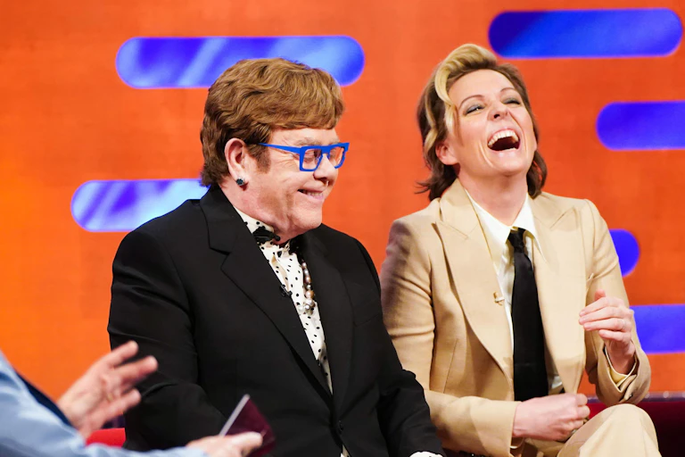 Elton John and Brandi Carlile laughing