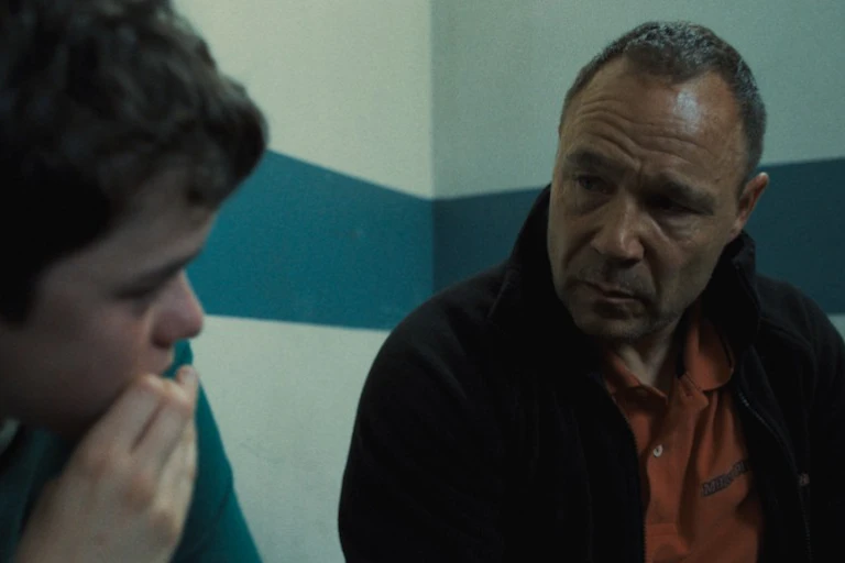A boy and a father in discussion.