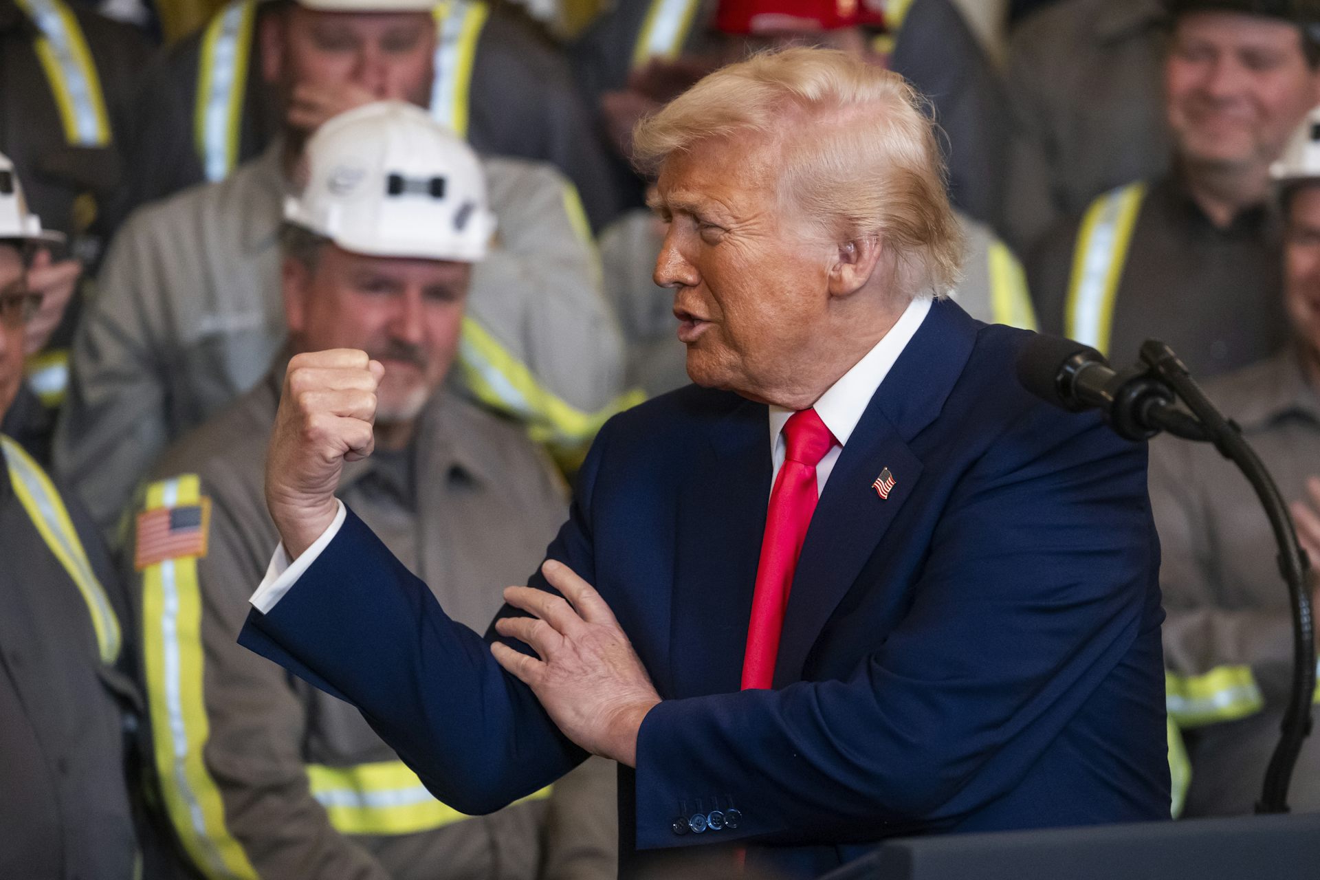Donald Trump feels his own bicep during a speech in front of coal workers.
