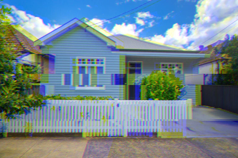 A residential house on a street glitching out