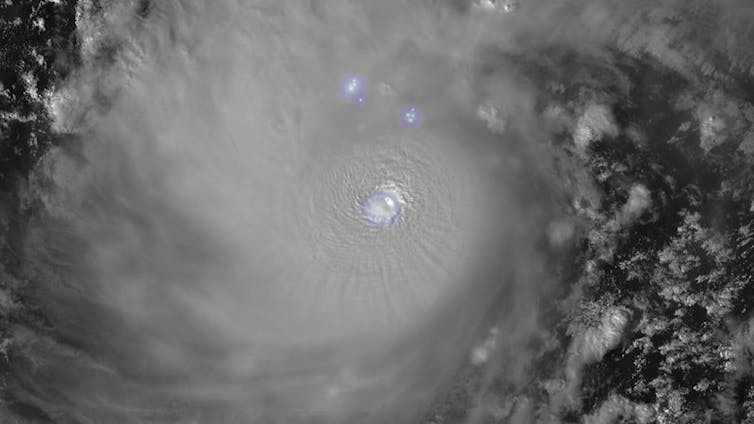 a grey swirly cloud with two bright circles