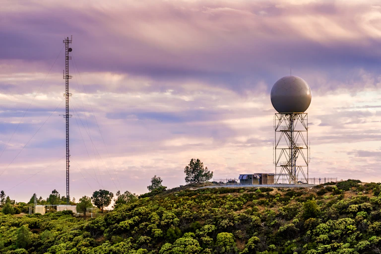 a weather station on a green surface