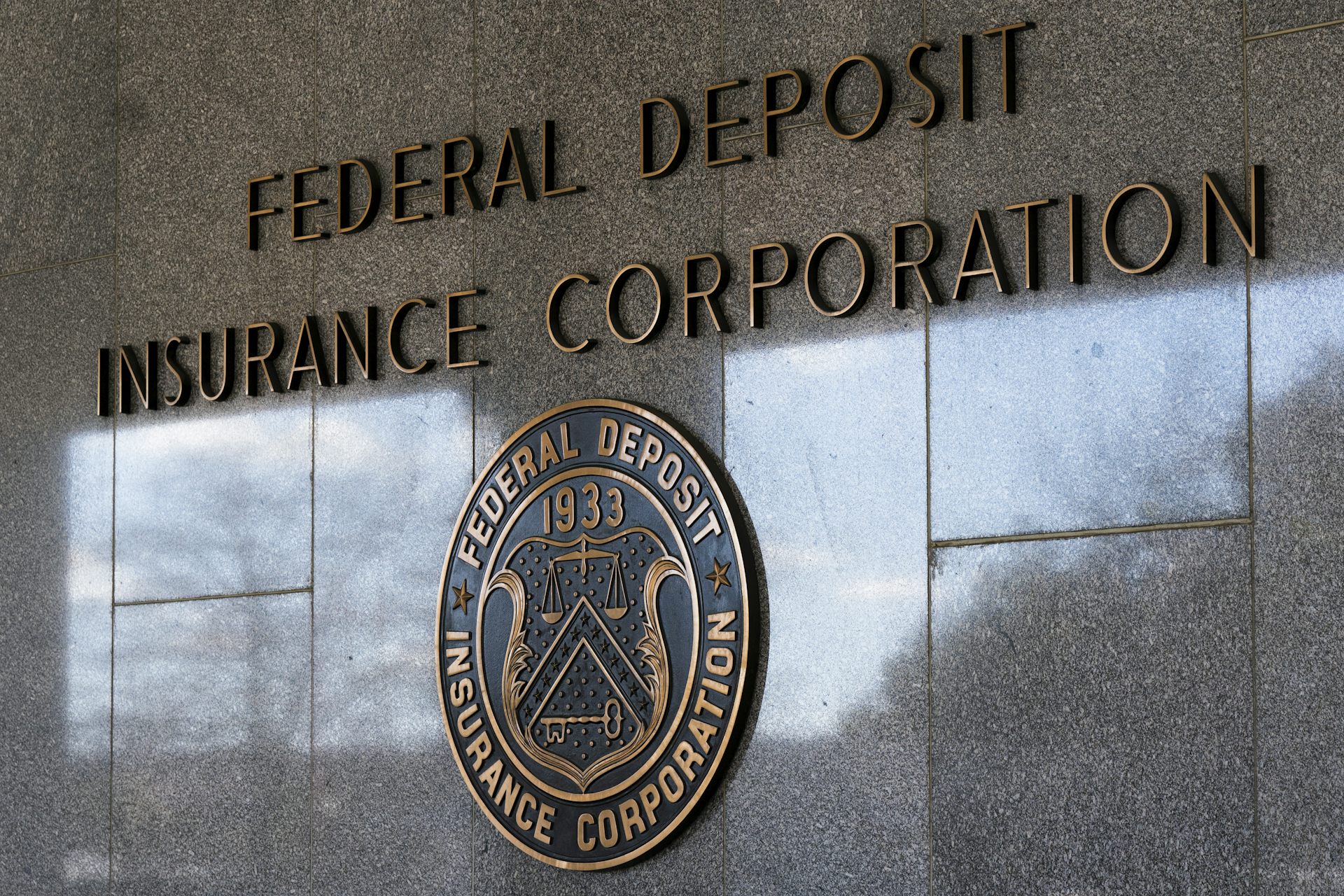 Federal Deposit Insurance Corporation seen on the outside of a building above the corporation's seal