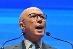 Man speaking at a lectern