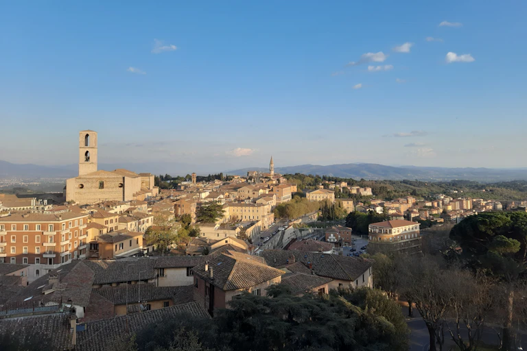 scenic shot of Italian city and green countryside