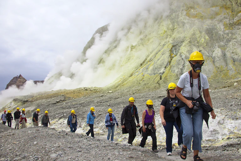 tourists walking on White Island in 2010.