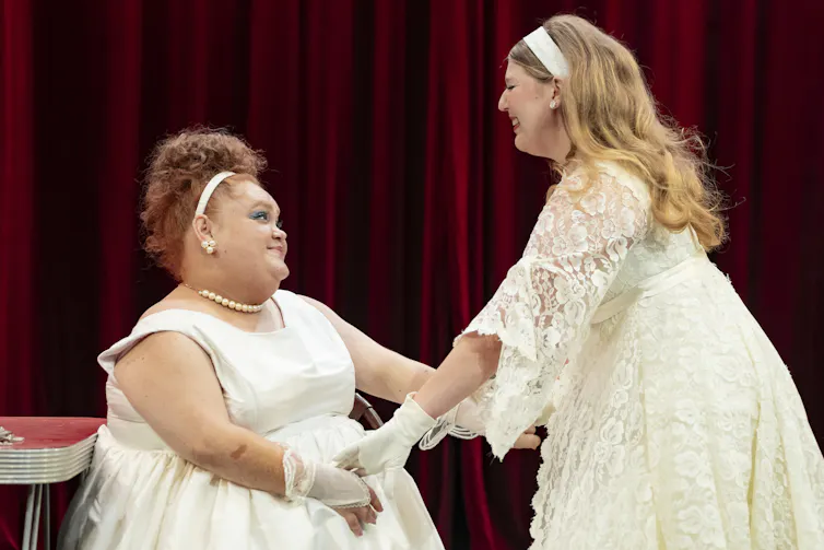 Production image: two young women in white.