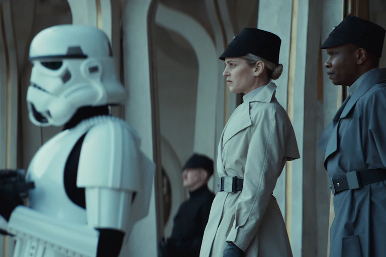 Production image: Stormtroopers and two humans.