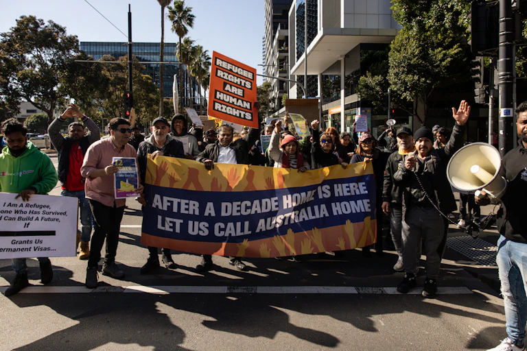 People participate in a refugee solidarity rally outside the Victorian office of the Australian Labor Party in Docklands, Melbourne, Monday, August 12, 2024
