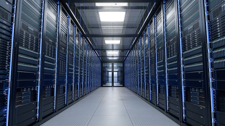 A corridor with server Racks and cabinets full of hard drives