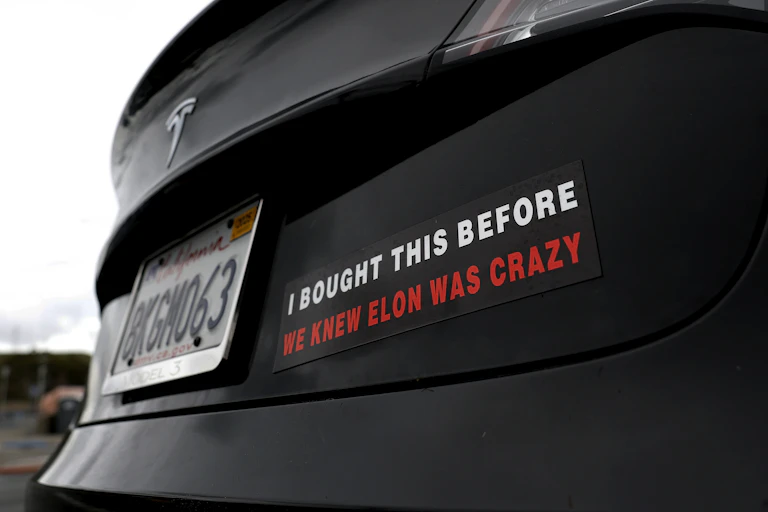 Bumper sticker on a Tesla