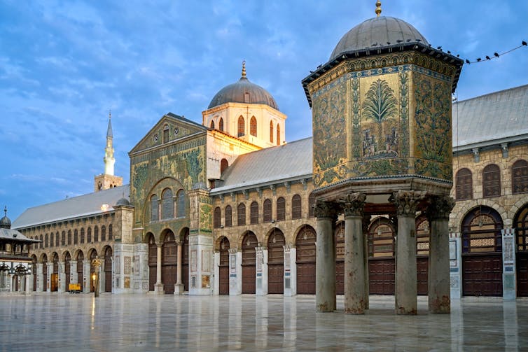 A mosque decorated with gold mosaics.