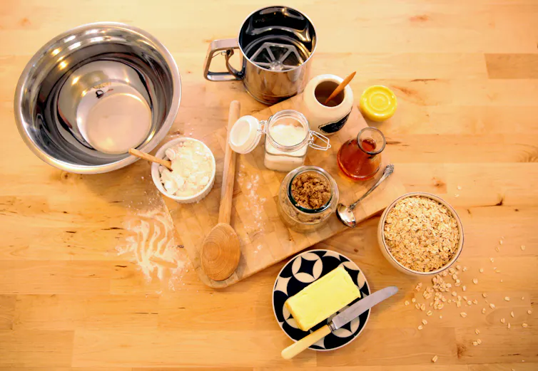The ingredients to make Anzac biscuits on a table.