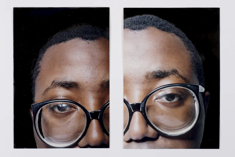 Two photographs of Donald Rodney wearing large glasses.