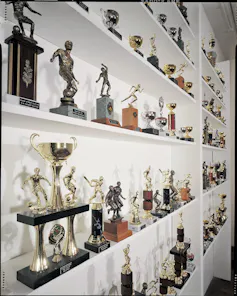 Trophies with engraved texts in a cabinet