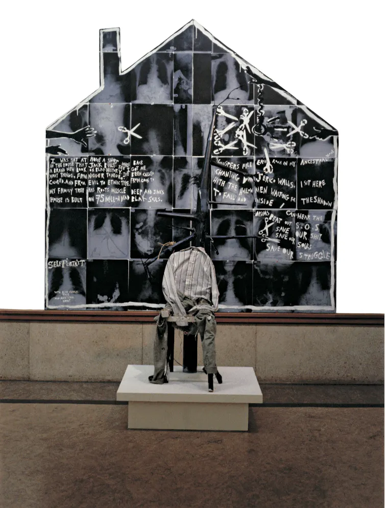 A house made up of images of X-rays, with the figure of a man sat before it.