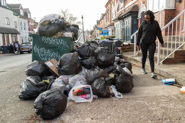 Piles of rubbish on a street in Birmingham.