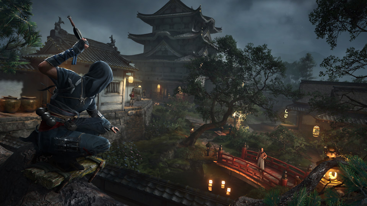 An assassin crouching over a scene with bridges and pagodas.