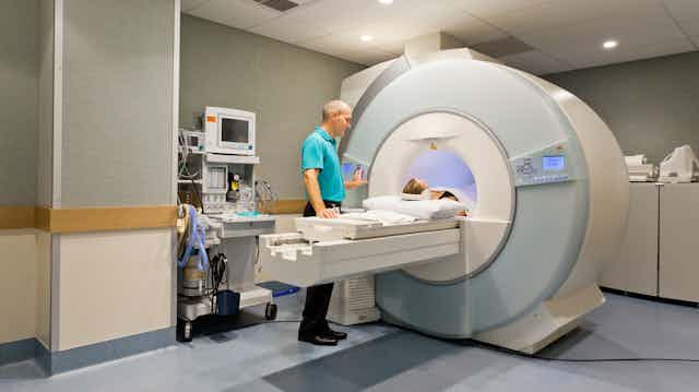A patient in a CT scanner. A patient in a CT scanner.