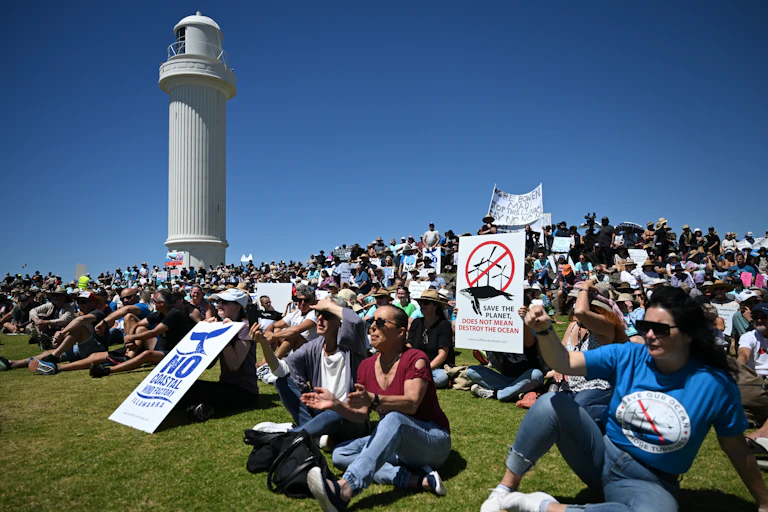 protesters gather at lighthouse