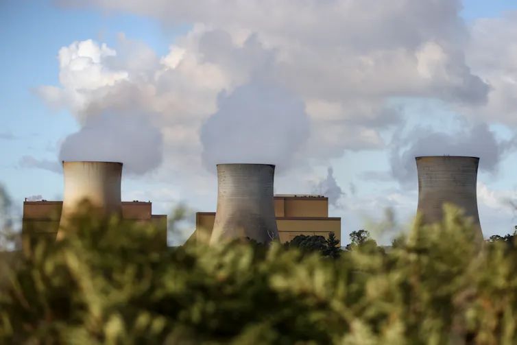 steam billowing from coal plant