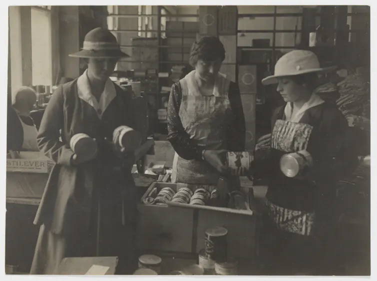 Black and white photo: three women.