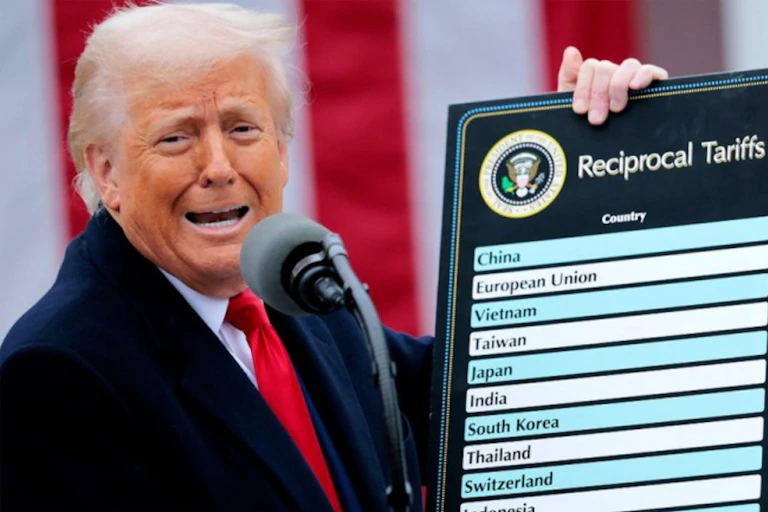 Donald Trump holds a poster showing some figures relating to tariffs the US was about to impose.