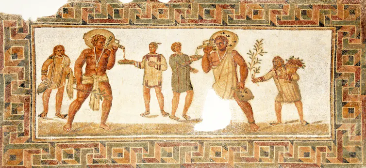 Roman slaves serving their masters on a Tunisian mosaic