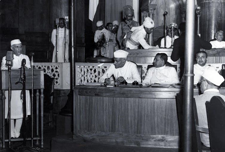 Trump takes a line from ‘world’s coolest dictator’ 3 Jawaharlal Nehru, the first prime minister of India, speaks at a podium in the Indian parliament in Delhi, wearing a traditional Indian white coat and hat. Other parliamentarians listen to his speech.