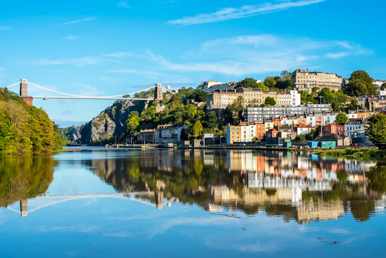 Clifton Suspension Bridge with Clifton and reflections on the river Avon.