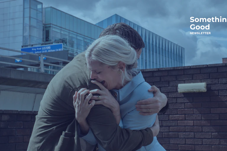 A man holding a wailing woman
