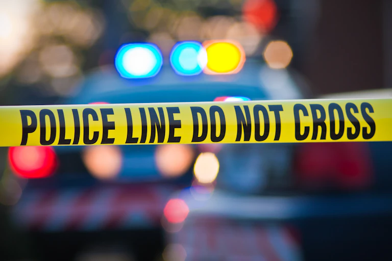 A police line marked with tape.
