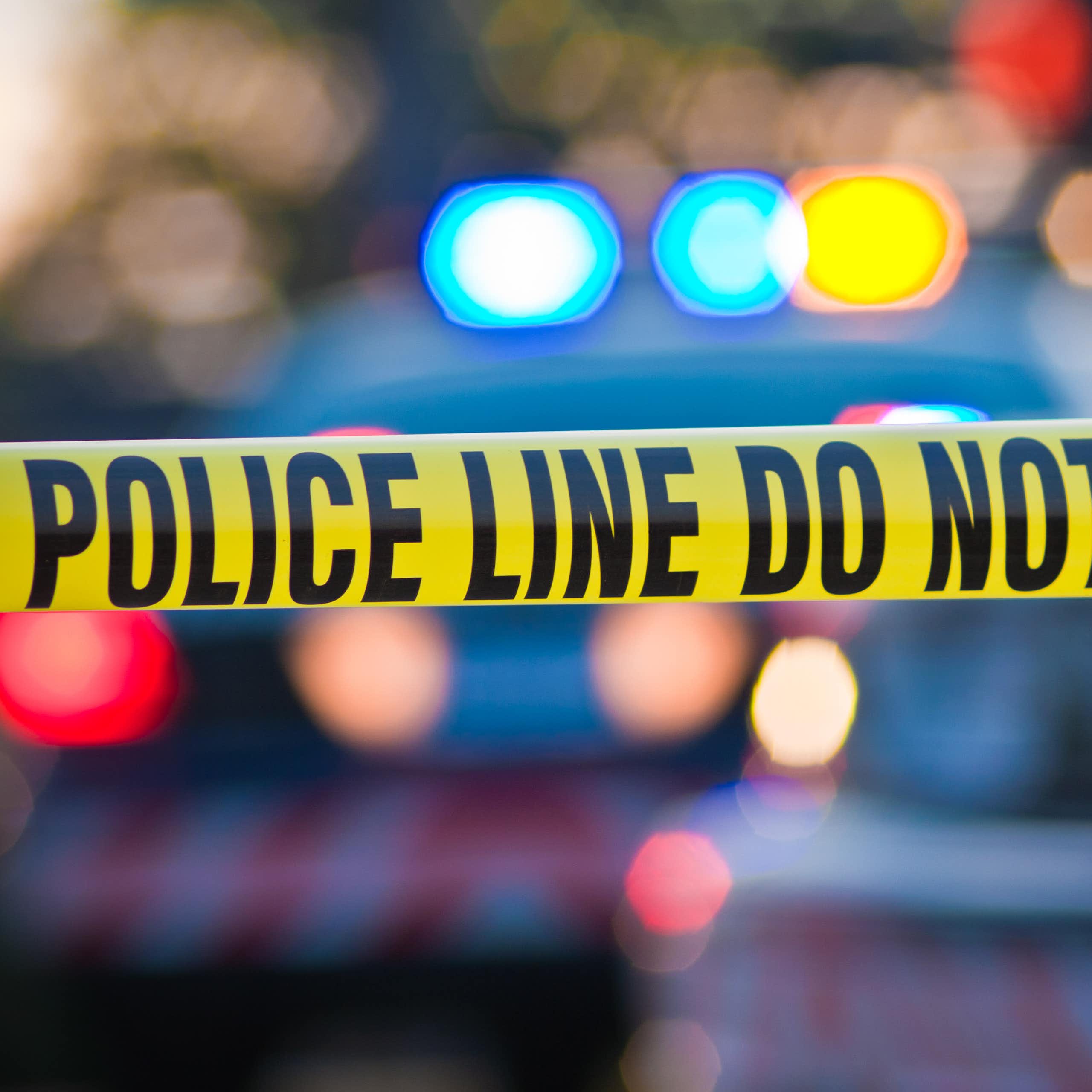 A police line marked with tape.